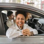 Customer reviewing car sale documents Dubai with an AZ Cars advisor