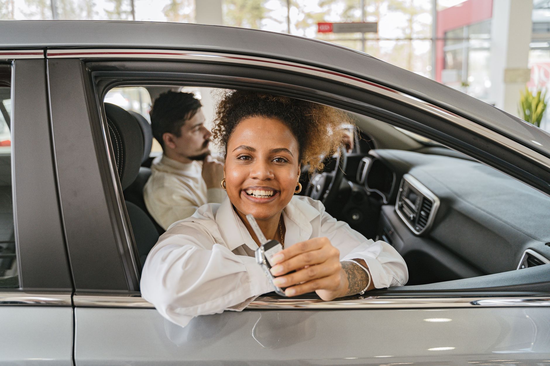 Customer reviewing car sale documents Dubai with an AZ Cars advisor