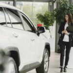 Customer reviewing car transfer documents Dubai with a professional AZ Cars advisor