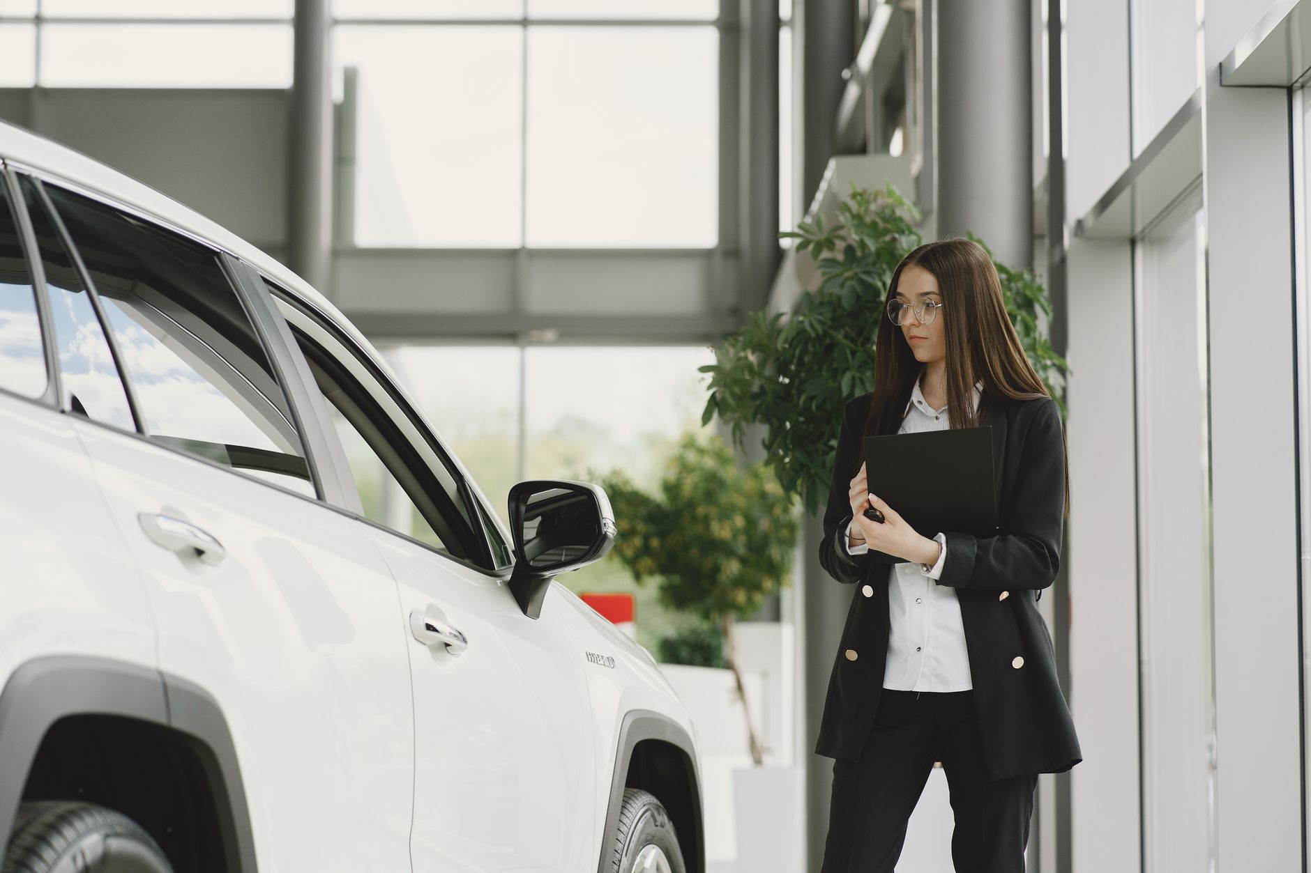 Customer receiving a real-time car price estimate in Dubai at AZ Cars showroom