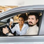 Car owner receiving the best car selling price in UAE at AZ Cars showroom