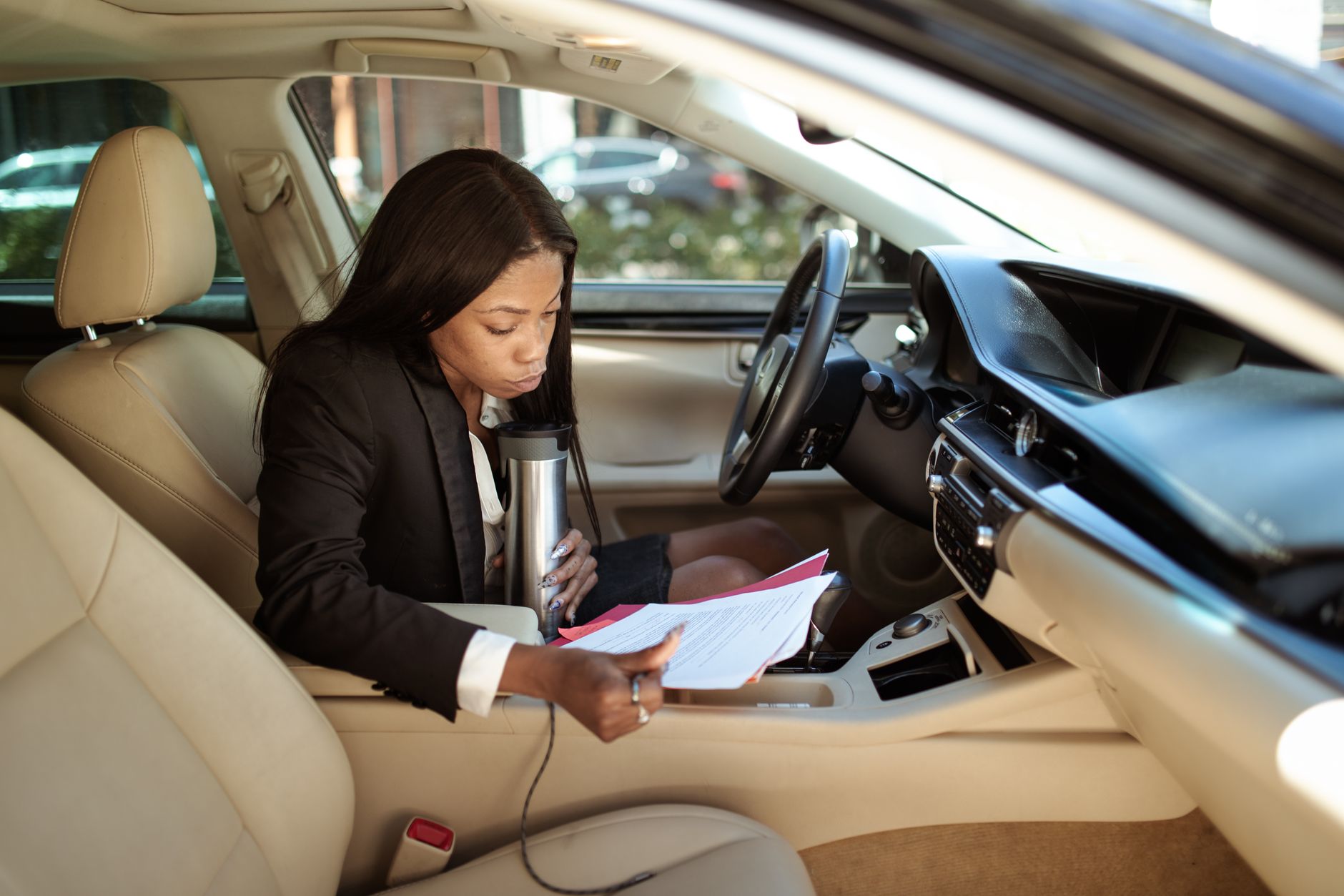 Customer reviewing sell your car documents Dubai with a professional advisor at AZ Cars
