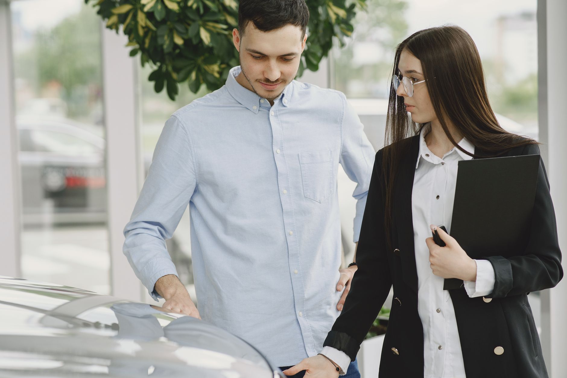 Customer completing a vehicle transfer service Dubai with AZ Cars agent